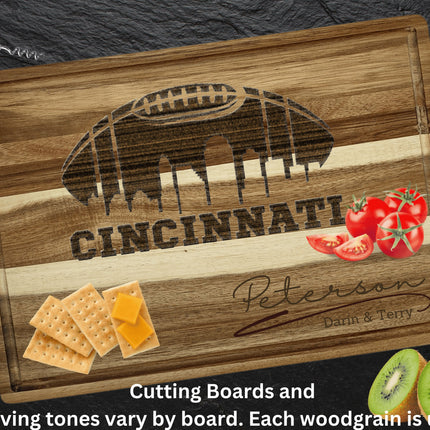 Custom Cincinnati football cutting board featuring the city skyline and a football design. Personalized as requested to make a great gift.