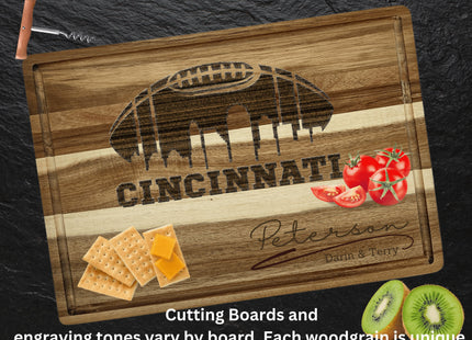 Custom Cincinnati football cutting board featuring the city skyline and a football design. Personalized as requested to make a great gift.