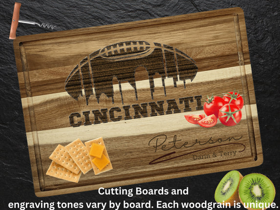 Custom Cincinnati football cutting board featuring the city skyline and a football design. Personalized as requested to make a great gift.