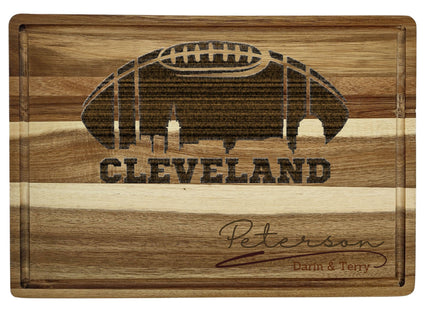 Custom Cleveland football cutting board featuring the city skyline and a football design. Personalized as requested to make a great gift.