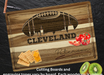 Custom Cleveland football cutting board featuring the city skyline and a football design. Personalized as requested to make a great gift.