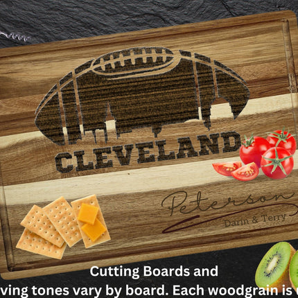 Custom Cleveland football cutting board featuring the city skyline and a football design. Personalized as requested to make a great gift.