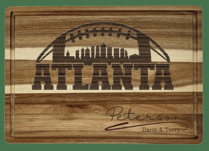 Custom Atlanta football cutting board featuring the city skyline and a football design. Personalized as requested to make a great gift.