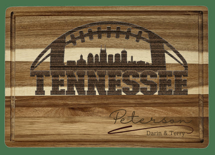 Custom Tennessee football cutting board featuring the city skyline and a football design. Personalized as requested to make a great gift.