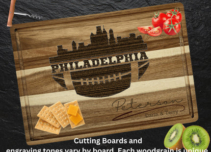 Custom Philadelphia football cutting board featuring the city skyline and a football design. Personalized as requested to make a great gift.