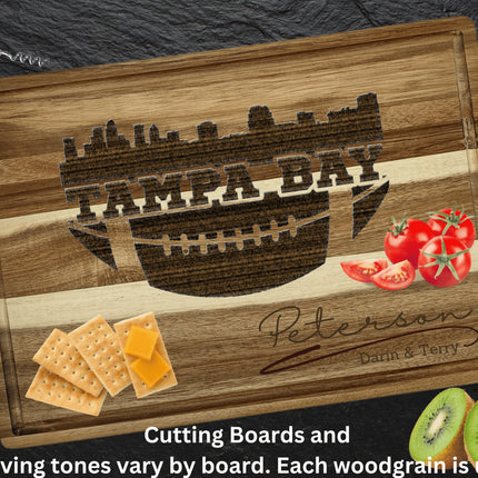 Custom Tampa Bay football cutting board featuring the city skyline and a football design. Personalized as requested to make a great gift.