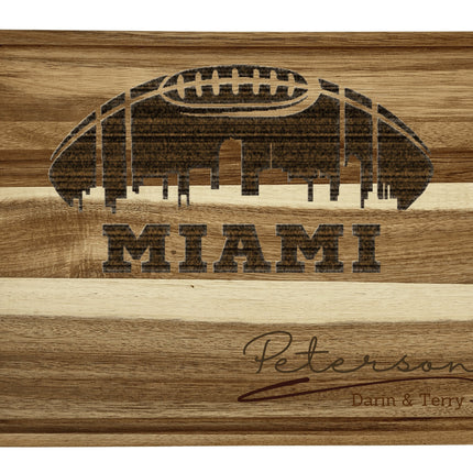Custom Miami football cutting board featuring the city skyline and a football design. Personalized as requested to make a great gift.