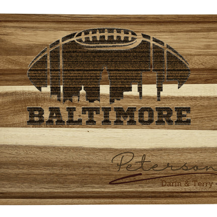 Custom Baltimore football cutting board featuring the city skyline and a football design. Personalized as requested to make a great gift.