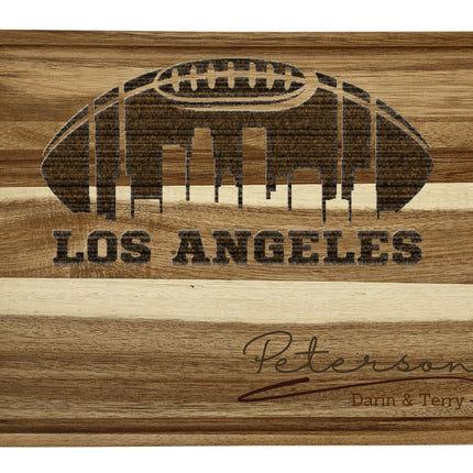 Custom Los Angeles football cutting board featuring the city skyline and a football design. Personalized as requested to make a great gift.