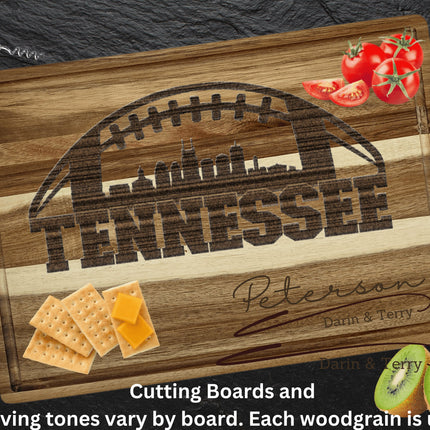 Custom Tennessee football cutting board featuring the city skyline and a football design. Personalized as requested to make a great gift.