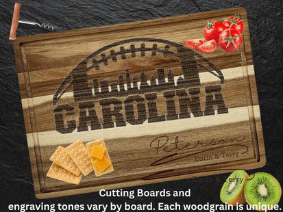 Custom Carolina football cutting board featuring the city skyline and a football design. Personalized as requested to make a great gift.