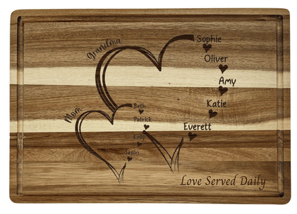 Custom family cutting board featuring the hearts and children&#39;s names. Personalized as requested to make a great gift.