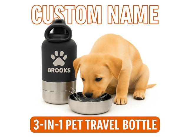 Golden puppy drinking water from a stainless steel bowl attachment next to a black and silver personalized pet water bottle labeled “BROOKS” with a paw print design. The scene is bright and clean, highlighting the product’s modern, travel-friendly design for pets.