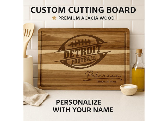 “Personalized Detroit football cutting board made from premium acacia wood, engraved with a football logo and the name ‘Peterson – Steven & Mary.’ Displayed on a kitchen counter with olive oil, utensils, and a cloth. Text above reads ‘Custom Cutting Board – Premium Acacia Wood’ and below, ‘Personalize with Your Name.’”