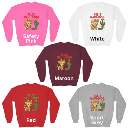 Five “Feliz Navi-Dog!” Christmas sweatshirts displayed in different colors — Safety Pink, White, Maroon, Red, and Sport Grey. Each sweatshirt features a festive Chihuahua wearing a sombrero and scarf beside a cactus decorated like a Christmas tree with a star on top and a plate of cookies nearby. The text “FELIZ NAVI-DOG!” appears above the illustration in bold letters.