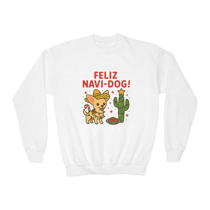 Alt text: White crewneck sweatshirt featuring a festive “Feliz Navi-Dog!” Christmas design. The graphic shows a cheerful Chihuahua wearing a sombrero and scarf next to a cactus decorated like a Christmas tree with a star on top and a plate of cookies nearby. The phrase “FELIZ NAVI-DOG!” appears above the illustration in bold red letters.