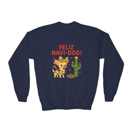 Navy blue crewneck sweatshirt featuring a festive “Feliz Navi-Dog!” Christmas design. The graphic shows a smiling Chihuahua wearing a sombrero and scarf next to a cactus decorated like a Christmas tree with a star on top and a plate of cookies in front. The phrase “FELIZ NAVI-DOG!” appears above the illustration in bold red letters.