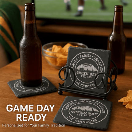 "Personalized Green Bay slate coasters engraved with 'Friends • Family • Tradition,' 'Green Bay Est. 1919,' and 'The Johnsons,' displayed on a wooden table with beer bottles, chips, and a TV showing a football game in the background. Text overlay reads 'Game Day Ready – Personalized for Your Family Tradition.'"