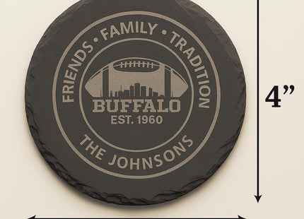 &quot;Round black slate coaster measuring 4 inches in diameter, engraved with a Buffalo football design featuring a city skyline and the text &#39;Friends • Family • Tradition,&#39; &#39;Buffalo Est. 1960,&#39; and &#39;The Johnsons.&#39; Black arrows and labels indicate the 4-inch width and height of the coaster.&quot;