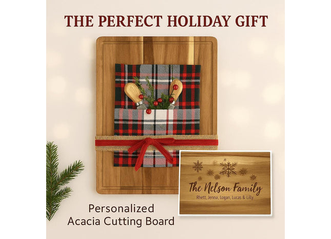 Holiday-themed personalized acacia cutting board displayed as a gift, wrapped with a red and black plaid cloth, small wooden utensils, greenery, and a festive red ribbon. A smaller inset image shows an engraved design with snowflakes and the text “The Nelson Family” along with family member names. The headline reads “THE PERFECT HOLIDAY GIFT” and the caption below says “Personalized Acacia Cutting Board.”