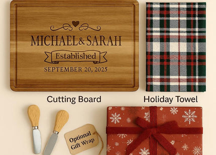 &quot;Display of what&#39;s included in a personalized cutting board gift set. Items shown are an engraved acacia cutting board with the names &#39;Michael & Sarah&#39; and an established date, a folded holiday plaid towel, two wooden-handled cheese spreaders, and an optional gift-wrapped box with a red snowflake design and ribbon.&quot;