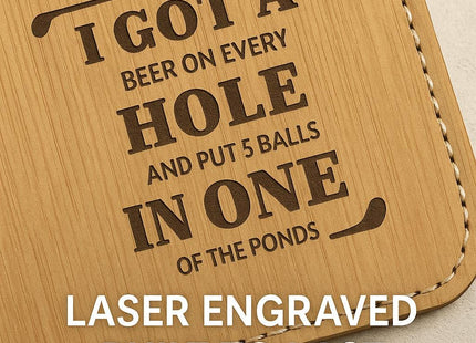 &quot;Close-up of a tan bamboo leather golf tag with engraved text that reads &#39;I got a beer on every hole and put 5 balls in one of the ponds,&#39; framed by golf club icons. White text overlay at the bottom reads &#39;Laser Engraved Built to Last,&#39; highlighting the durability and precision of the engraving.&quot;