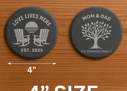 “Two round personalized slate coasters displayed on a wooden surface, each measuring 4 inches in diameter. One features ‘Love Lives Here – Est. 2025’ with rocking chairs and sunset, and the other reads ‘Mom & Dad – The Johnson Family’ with a family tree. Text on image highlights the 4-inch size with an arrow showing diameter.”
