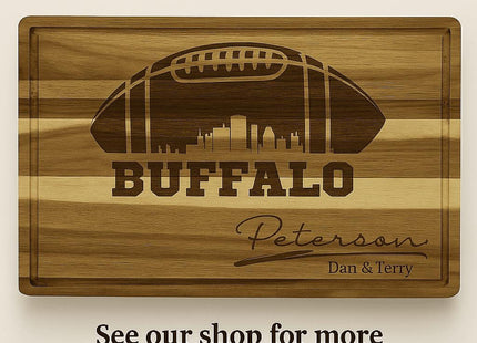 &quot;Engraved acacia wood cutting board with a football design and the text &#39;Buffalo&#39; featuring a city skyline inside the football. The board is personalized with the name &#39;Peterson&#39; and &#39;Dan & Terry&#39; beneath it. Above the board, text reads &#39;Consider Purchasing:&#39; and below it says &#39;See our shop for more related products.&#39;&quot;