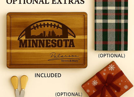 &quot;Flat lay image showing a personalized Minnesota football cutting board engraved with a skyline and football design labeled &#39;Peterson • Steven & Mary.&#39; Text above reads &#39;Included & Optional Extras.&#39; The cutting board is shown with optional accessories: two cheese spreader knives, a plaid towel, and a red snowflake-patterned gift box with ribbon. The board itself is labeled &#39;Included,&#39; while the others are marked &#39;Optional.&#39;&quot;