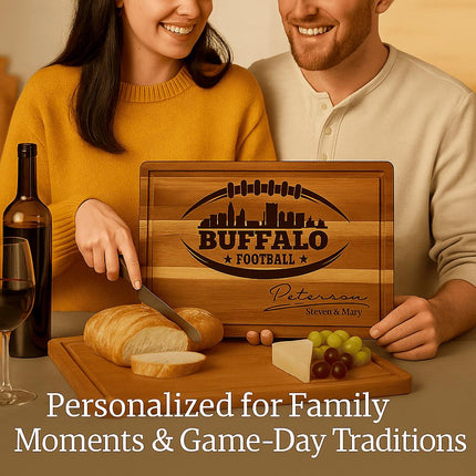 "Smiling couple enjoying wine and cheese while using a personalized Buffalo Football cutting board engraved with a football and skyline design and the name 'Peterson.' The board is displayed with bread, cheese, and grapes on a dining table. Text reads 'Personalized for Family Moments & Game-Day Traditions,' emphasizing warmth and togetherness."