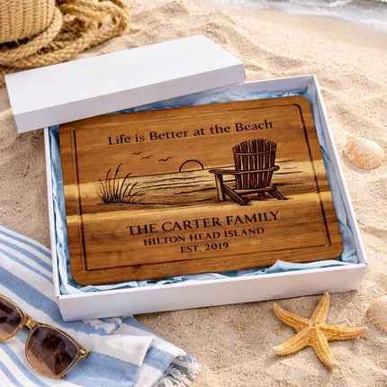Personalized cutting board in white gift box with beach background starfish and coastal decor gift presentation