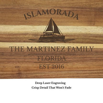 Close up of Islamorada Florida Keys sailboat cutting board engraving showing detailed sailboat design and clean acacia wood grain