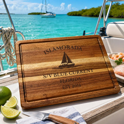 Islamorada Florida Keys sailboat cutting board on a boat cockpit table with turquoise water bright sunlight and relaxed coastal lifestyle setting