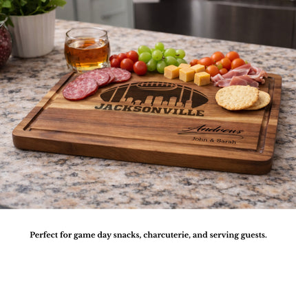 Jacksonville football cutting board used as a charcuterie serving board with meats cheese and snacks