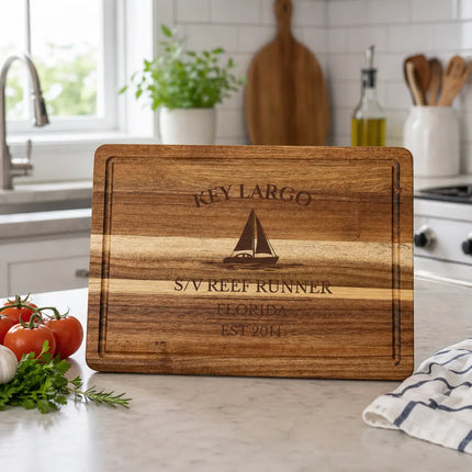 Key Largo Florida Keys sailboat cutting board on a boat cockpit table with clear blue water bright sunlight and reef coastal setting