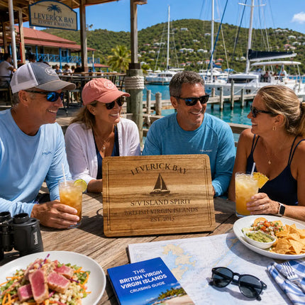 Leverick Bay British Virgin Islands personalized cutting board being shared during a waterfront lunch gathering overlooking marina docks catamarans and North Sound cruising waters