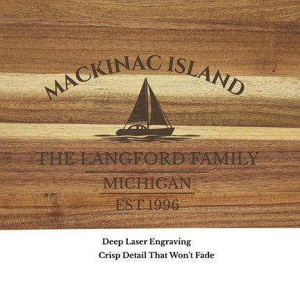 Close up engraving of Mackinac Island Michigan sailboat cutting board showing custom boat name and detailed wood grain