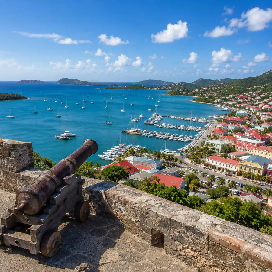 Elevated panoramic view of Marigot Harbor and Saint Martin coastline from historic Fort Louis overlooking sailboats and the harbor below.