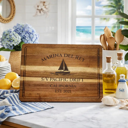 Marina del Rey nautical cutting board displayed in a bright coastal kitchen with ocean view lemons and nautical decor