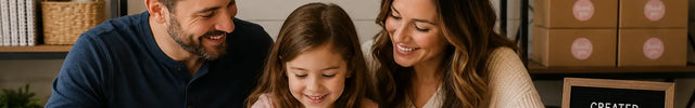 Warm lifestyle image of a family-owned creative business where parents and child enjoy coloring together, representing the heart and values behind Markers & Milestones.