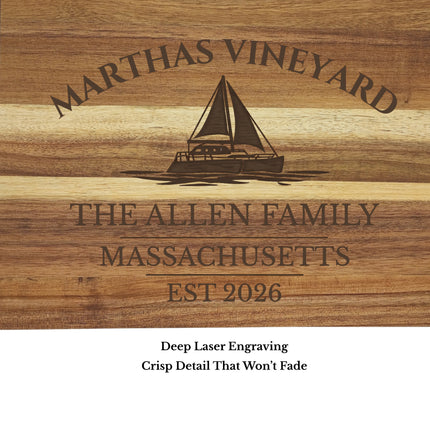 close up engraving detail Marthas Vineyard Massachusetts sailboat cutting board showing laser engraved sailboat and harbor name