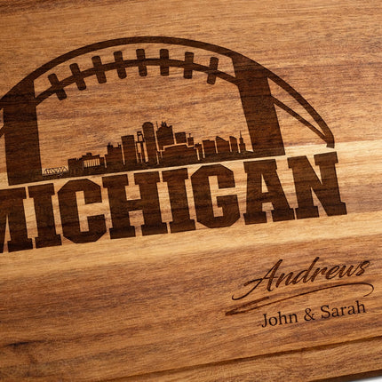 Close-up of natural dark brown laser engraving on Michigan football cutting board