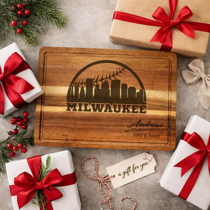 Personalized Milwaukee baseball cutting board presented as a gift with wrapped boxes ribbon and decorative elements