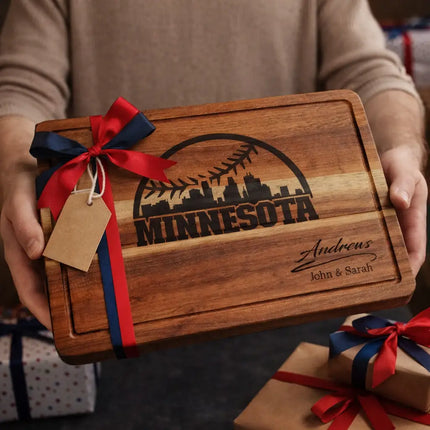 Personalized Minnesota baseball cutting board presented as a gift with red and navy ribbon and wrapped boxes