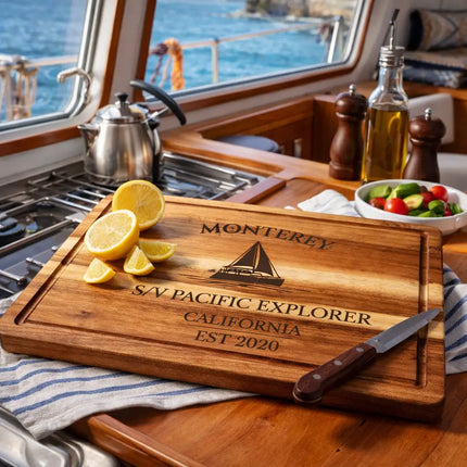 Monterey California sailboat cutting board displayed in coastal kitchen with ocean view and fresh ingredients