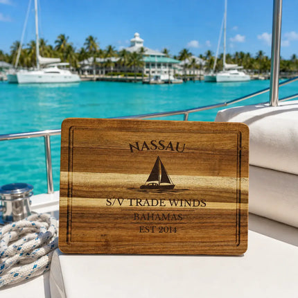 Nassau Bahamas sailboat cutting board on a yacht deck overlooking brilliant turquoise Caribbean water and tropical marina scenery