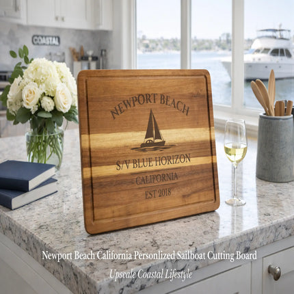 Newport Beach California personalized sailboat cutting board Blue Horizon displayed in upscale coastal kitchen lifestyle luxury home decor