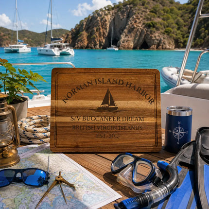 Norman Island Harbor British Virgin Islands sailboat cutting board displayed aboard a catamaran beside turquoise Caribbean anchorages rocky island cliffs and tropical sailing scenery
