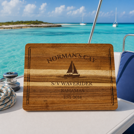 Norman’s Cay Bahamas sailboat cutting board overlooking shallow turquoise Exumas water with remote sandbars and anchored cruising sailboats