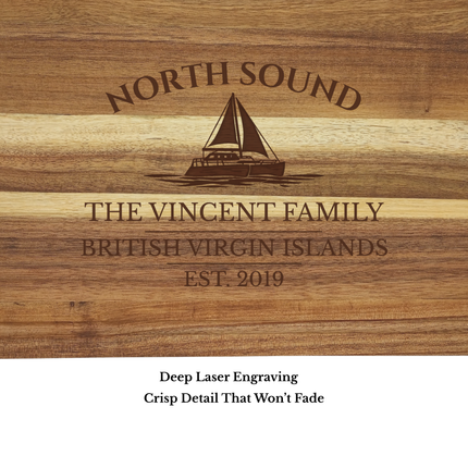 Close up of North Sound British Virgin Islands sailboat cutting board engraving showing detailed sailboat design and acacia wood grain